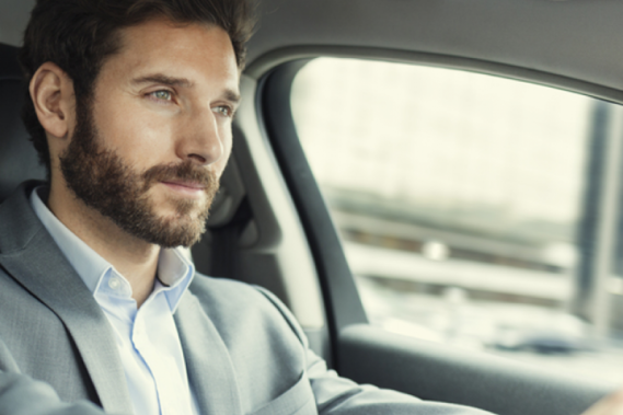 Man in a car driving Man in a car driving